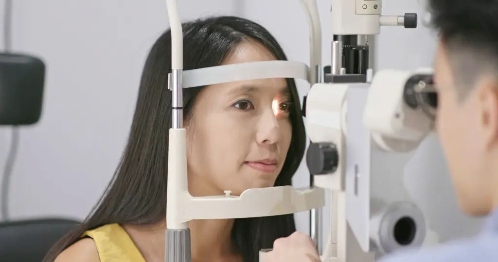 ophthalmologist inspecting a patient s eyes