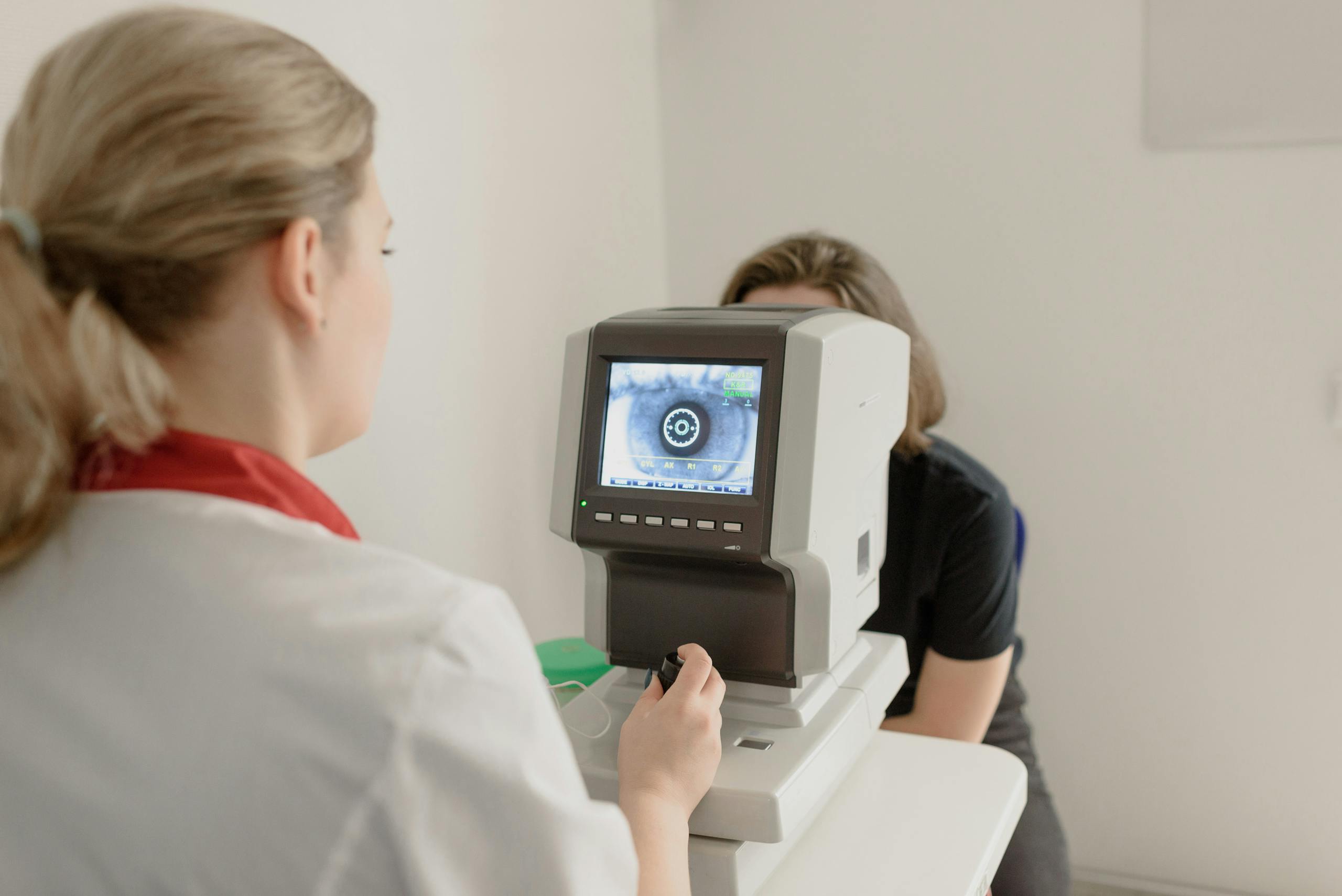 Professional eye examination using advanced equipment in a modern clinic setting.