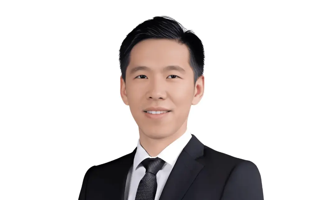 dr leslie ang pek seng with black suit on a white background